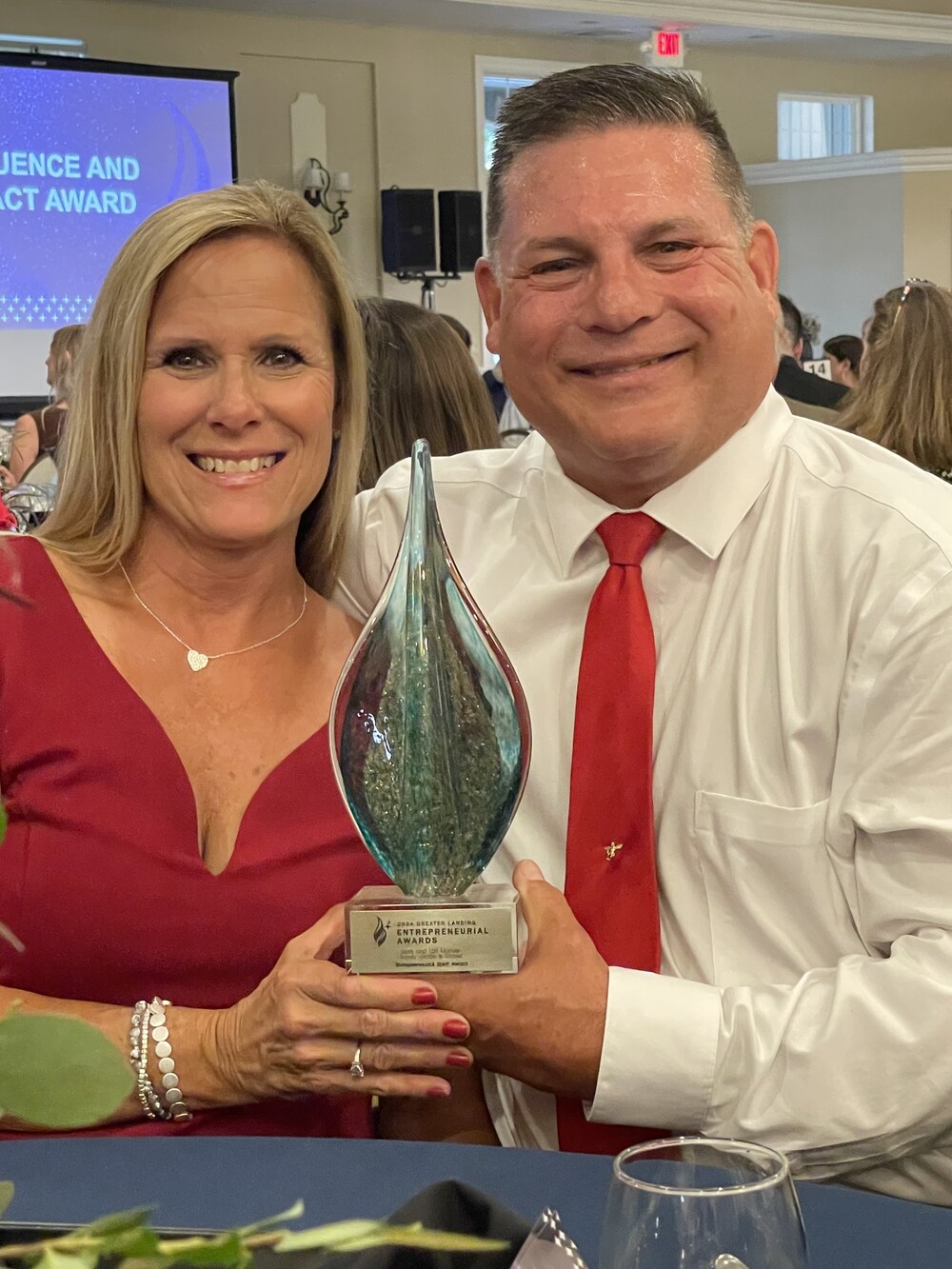 Mark and Lori Manyen with the 517 Magazine 2024 Entrepreneurial Spirit Award trophy